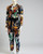 Shein x De Johnea Bianca Multicolour Jumpsuit angled front in long sleeves, taped legs, button-down front & bold pattern