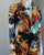 Shein x De Johnea Bianca Multicolour Jumpsuit closeup front with black belted waist & bold prints