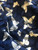 Stella Morgan Navy Butterfly Print Mini Dress closeup of blue textured fabric with various sizes of white butterflies