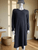 Truworths Casual Knit Grey Midi Dress front view in long sleeves, ribbed cuffs & large curved pockets on mannequin