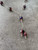 Purple Beaded Wire Necklace flat-lay with silver wire strand & beads with coloured flower detail