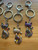 Cat Charm for Bags or Keys – group view of assorted multicolour cat keychains with floral ears