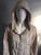 Cream Flower Appliqué Hooded Jacket closeup front with hood on mannequin, drawstrings showing, relaxed collar & silver zipper
