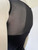 Black & White Overlay Mini Dress upper back close-up of sheer black mesh & plain black fabric below