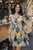 Floral Cut Out Mini Dress - front view worn on model showing vibrant floral pattern, long sleeves & waist cut-outs