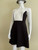 Vero Moda Monochrome Skater Mini Dress angled front with black fit & flare skirt & white neckline & black vertical side panels on the sides