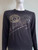Versace Medusa Long Sleeve Black Top front view in long sleeves & Versace abstract chest graphic