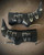 Versace Black Leather Pin-Point Buckle Boots top view with 5 silver V-buckles, sculpted pin heels in silver-tone finish