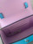 Versace La Medusa Turquoise Mini Bag pink interior view with 3 card slots, Certilogo tag & shoulder strap loops on flap
