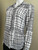 Woolworths Black Line Pattern Blouse angled front view with white base and black grid lines print, collar & long sleeves.