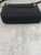 YSL Black Nolita Mini Crossbody Bag bottom view showing no wear on lambskin with gold chain hardware visible at sides