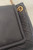 YSL Black Nolita Mini Crossbody Bag close front corner in lambskin texture with Saint Laurent engraved on gold chain ring