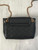 YSL Black Nolita Mini Crossbody Bag back view in black quilted lambskin & gold chain strap across upper edge