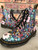 Dr. Martens 1460 Pascal Wanderlust Boots angled front view with lace-ups, rounded toe & all-over botanical print