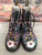 Dr. Martens 1460 Pascal Wanderlust Boots direct front view with black laces, pink floral toe panels & yellow welt stitching