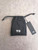 Y-3 Black Bifold Leather Wallet – front flat lay of wallet inside Y-3 black dust bag with white logo & with branded tag
