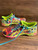 Asics Gel-Noosa Tri 11 Running Shoes - side profiles showing structured overlays, sole unit & multi-colour details