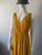 Mango Yellow Sleeveless V-Neck Maxi Dress front angled view with textured mustard fabric & adjustable waist