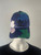 Adidas Blue Floral Peak Cap front view on mannequin showing curved peak, structured fit & floral design