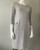 Earthaddict Grey Textured 3/4 Sleeve Midi Dress angled front with straight silhouette with wide panel hem