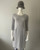 Earthaddict Grey Textured 3/4 Sleeve Midi Dress front view with round neck & front zip pockets on the sides