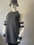 Grey & White Oversized Fleece Sweater front angled view with oversized fit - sleeves over the hands & thigh length