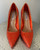 Steve Madden Orange Rhinestone Stiletto Heels front view with vibrant orange rhinestones covering the heels