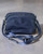 TUMI Blue Voyageur Luanda Flight Crossbody Bag front in navy with adjustable strap & TUMI logo on front