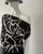 Kameo Black Asymmetric One Shoulder Blouse front side angled view with soft drape off the left shoulder
