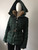 Michael Kors Green Belted Puffer Fur Hood Jacket angled side view showing extended rib-knit inner cuffs & gold hardware