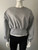 Grey Fleece Oversized Cropped Sweater front view with round neck, long balloon sleeves & ribbed cropped waistband
