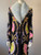 Versace Ventagli La Greca Coat closer front view with light blue fur collar, Medusa buttons, lapel & ornate fan, chain print