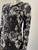 Michael Kors Metallic Floral Sequin Mini Dress closer angled front of fitted silhouette & detailed sequin flowers all over