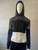 Black Mesh Panel Hooded Crop Top angled front view with drawstring hood, long sleeves & gathered cropped waistband