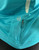 Adidas Climacool Turquoise Running Tank Top close up of concealed rear zip pocket with cable outlet