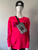 Guess Neon Fuchsia Logo Knit Sweater styled with Guess black peak cap & Guess black & grey monogram bag across the chest