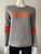 C(inch) Grey Tomboy Logo Sweater closer front view with 2 neon orange bands below each elbow & smooth grey finish