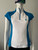 Pringle of Scotland White & Blue Quarter Zip Golf Shirt closer front view with white front panel, blue side panels & short sleeves