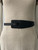 Black Faux Leather Buckleless Waist Belt front view on mannequin with wider belt styled on the left