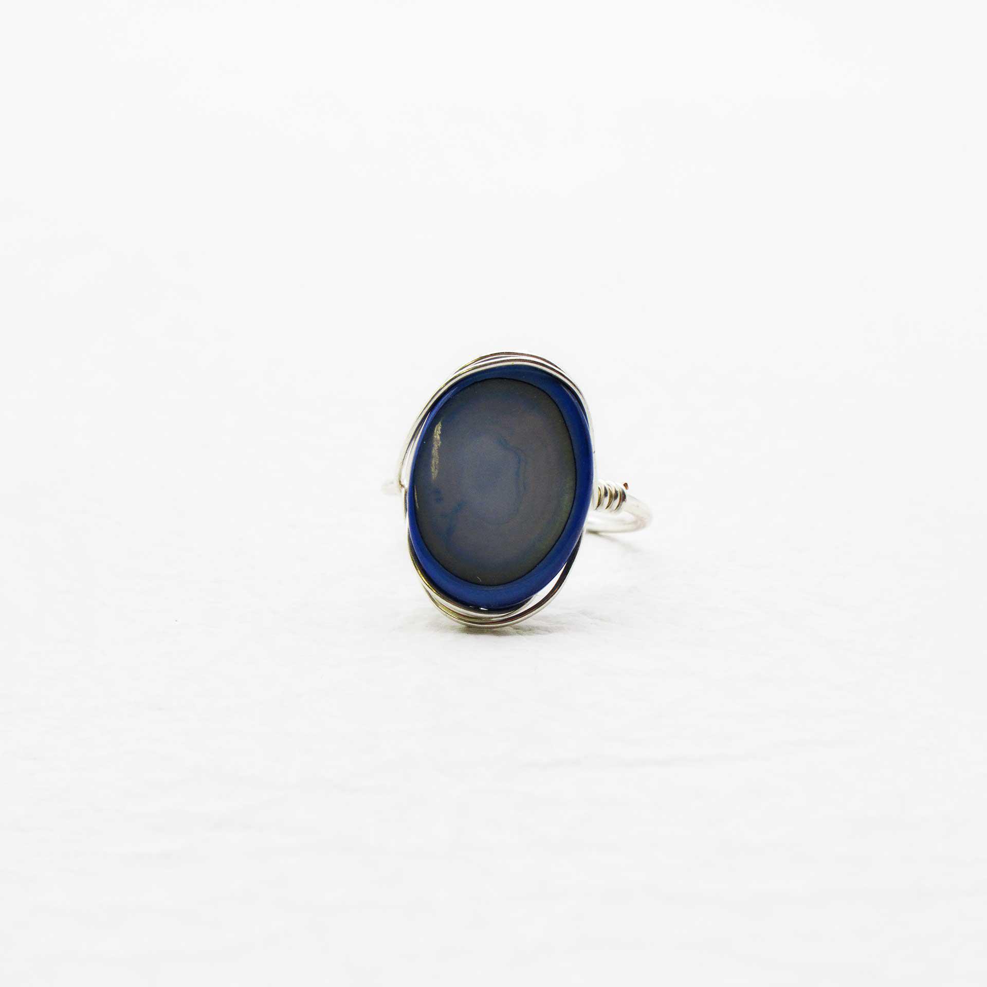 Hand Crafted Silver Wire Wrapped Ring Around Oval Iridescent Blue Stone