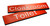 Engraved Sign with adhesive backing - 300x100mm White text on red - Safety Sign