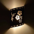 WL65 Ruidoso Southwestern Wall Sconce with Hummingbird design - night view