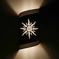 WL64 Chama Southwestern Twist Wall Sconce Sun Design- Night View