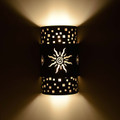 WL78 Artesia Southwestern Wall Sconce with straight edge sun design front tier- Night View