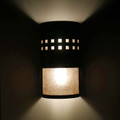 WL150 Vaughn Southwestern Two Tier Wall Sconce with Lines of Squares Custom Design Top Tier and Open Bottom Tier Design - Night View