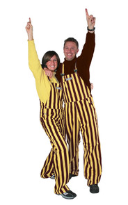 A man and woman wearing striped brown & gold game bib overalls.