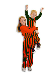 Youth fan in green and orange striped overalls cheering in Game Bibs