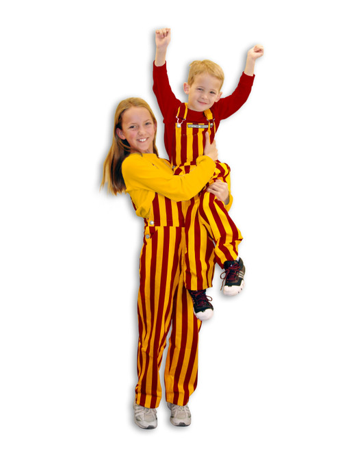 Two kids wearing striped maroon & gold youth game bib overalls.