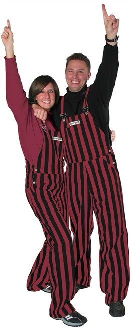 A man and woman wearing striped garnet & black game bib overalls.