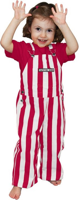 Toddler wearing crimson and white striped cotton overalls with adjustable straps, smiling at a game-day event